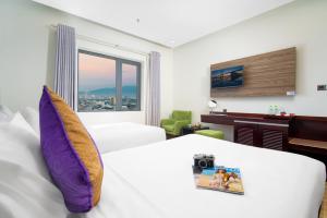 Letto o letti in una camera di Alani Sea View Hotel