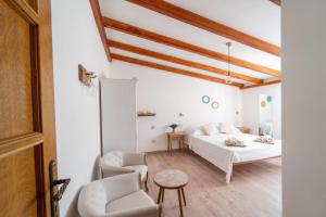 Postel nebo postele na pokoji v ubytování Domo Papiros B&B