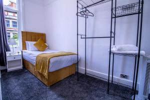 a bedroom with two bunk beds and a window at Oxford Street Grandeur - Perfect for Large Groups in London