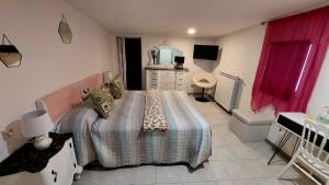 a small bedroom with a bed and a mirror at Il Mirto E La Rosa in Arenella