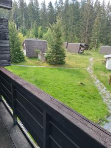 a view of a yard from the balcony of a house at Hotel Bečva na Horní Bečvě in Horní Bečva