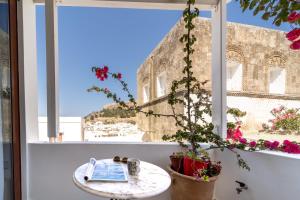 a window with a view of the coliseum at Villa Dafni - Lindos in Lindos