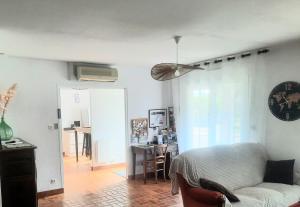 a living room with a couch and a table at GITE CHEZ MONETTE in Nance