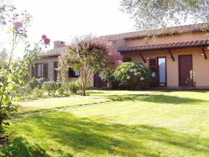 a house with a green yard in front of it at Montecasciano - Ciclamino in Capranica