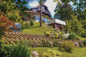 a garden in front of a house at Bonidesa House With Whirlpool in Ljubno