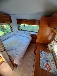 Ένα ή περισσότερα κρεβάτια σε δωμάτιο στο A Night at the Museum Vintage Glamping