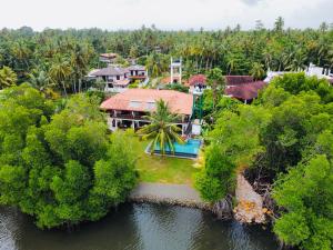 an aerial view of a house on the water at Lagoon Bentota Resort in Bentota