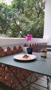 a plate of food on a table on a balcony at Studio climatisé intra muros balcon in Avignon