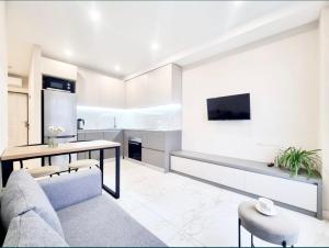 a living room with a couch and a table at Most City Area Lux Studio in Dnipro