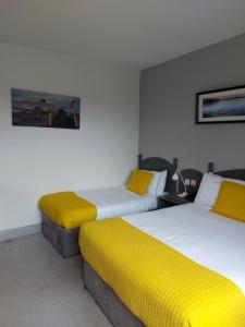 Rúm í herbergi á Ferryport House B&B