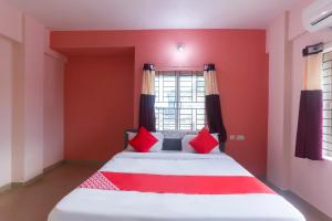 Postel nebo postele na pokoji v ubytování Hotel O Avigna Residency