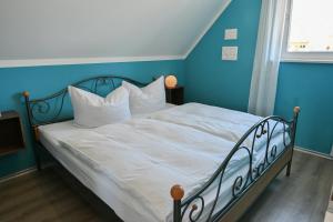 Katil atau katil-katil dalam bilik di Ferienwohnung Dünenrose +10 gambar