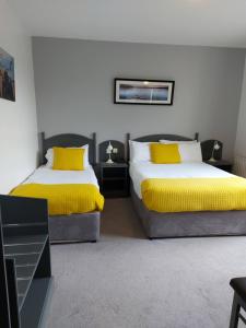 Rúm í herbergi á Ferryport House B&B