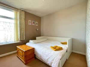 Ένα ή περισσότερα κρεβάτια σε δωμάτιο στο Sheffield's 3BR Retreat