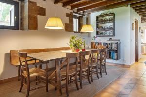 a kitchen with a large wooden table and chairs at ATeRIAN ALTAMIRA in Getaria