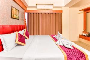 Mount Amara Hotel & Spa, Siliguri客房内的一张或多张床位