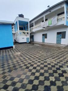 a large white building with a checkered floor at Kelly Homes in Kilifi