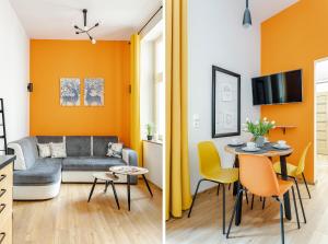 un soggiorno e una sala da pranzo con pareti arancioni di Apartament Fair Targi Dworzec POZNAŃ Gąsiorowskich a Poznań