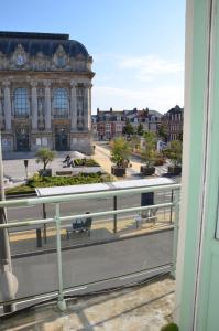 a view of a building from a balcony at Le Gambetta Théâtre de Calais in Calais