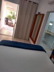 Ein Bett oder Betten in einem Zimmer der Unterkunft Pousada Rosa de Saron