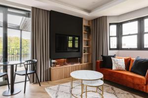 a living room with a couch and a table at The Cliffe at the Quay in Donegal