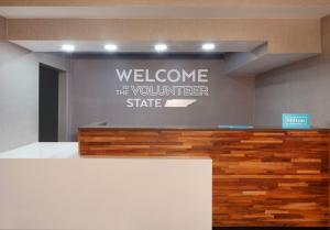a welcome to the volunteer state sign on a wall at Hampton Inn Athens in Athens