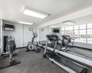 a gym with several exercise equipment in a room at Quality Inn Moncton in Moncton