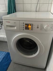 a washing machine with a digital clock on it at Düsseldorf Flingern in Düsseldorf