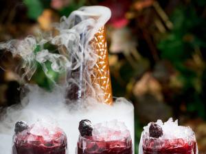 a vase filled with ice and blackberries at Fairmont Quasar Istanbul Hotel in Istanbul