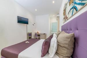 Postel nebo postele na pokoji v ubytování Hotel Soffio D'Estate