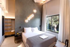 Ένα ή περισσότερα κρεβάτια σε δωμάτιο στο Villa Masticha Sweet by Villa Plus