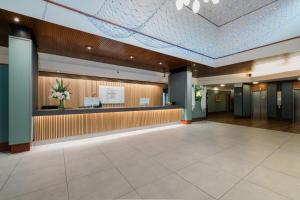 a lobby of a hospital with a waiting area at Normandy Hotel (Near Glasgow Airport) in Paisley
