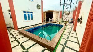 a swimming pool in the backyard of a house at 001 Apartments in Oshogbo