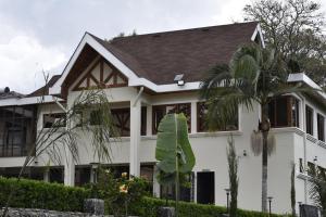 a house with a large banana leaf in front of it at HAVEN STAY HOTEL in Eldoret