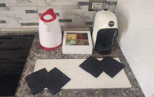 a counter with a blender and a box on it at ViaGiotto Guest House in Certaldo