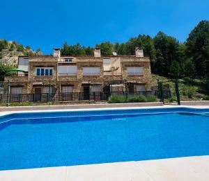 The swimming pool at or close to Dúplex Río Madera