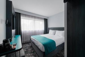a hotel room with a bed and a window at Normandy Hotel (Near Glasgow Airport) in Paisley +42 photos