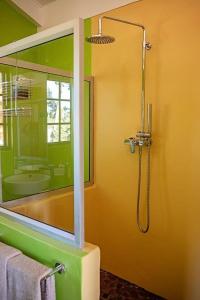 a bathroom with a shower with a tub and a sink at Boerfontein in Windmeul