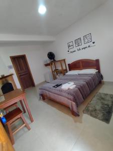 Cama ou camas em um quarto em Chalés e suítes lima