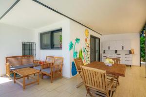 a dining room with a table and chairs at Ben Houses Family in Bodrum City