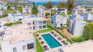 an aerial view of a villa with a swimming pool at Ben Houses Family in Bodrum City