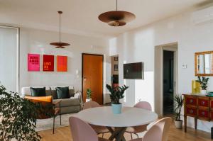 a living room with a table and a couch at Punta Penna Seahouse in Vasto