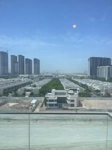 a view of a city with buildings in the background at Luxury Studio l Burj Khalif View in Dubai