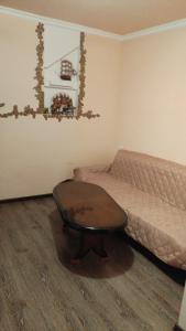 a small room with a bed and a table at Dava in Gyumri