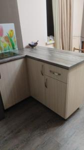 a kitchen with a counter with a counter top at Dava in Gyumri