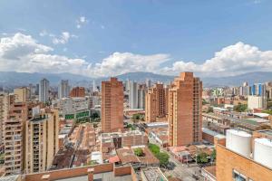 an aerial view of a city with tall buildings at Loft luminoso y moderno con excelentes vistas in Medellín