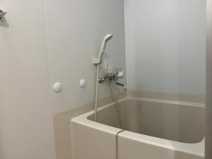 Koupelna v ubytování Capsule Hotel Suzumoriya