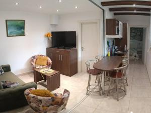 a living room with a couch and a table at Apartments 4M in Kostrena