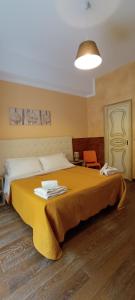 Postel nebo postele na pokoji v ubytování B&B Camere e Cassata