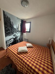 Ένα ή περισσότερα κρεβάτια σε δωμάτιο στο Duplex 8 pers au pied des pistes Valfréjus